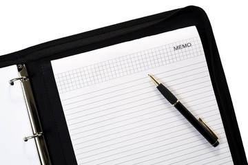 Naklejka premium ballpen on notepad inside ring-binder isolated