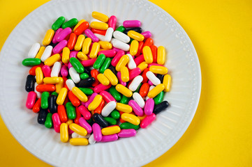 Colorful candy mix in white dish