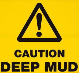 Caution deep mud warning sign
