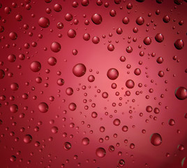 A many different droplet on the red background