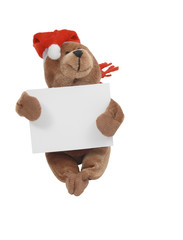 Cristmas teddy bear handing white tablet for your inscription