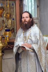 The Russian orthodox priest in a temple