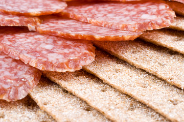 The sausage cut by slices on a dish