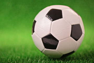 Fototapeta na wymiar Soccer ball on a green grass
