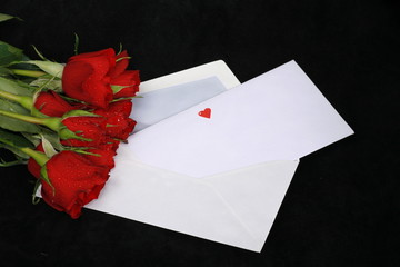 a loveletter on a dark background with rose and heart...........