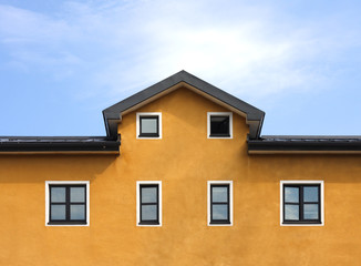 New orange building and blue sky background