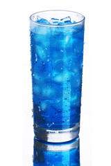 A glass with blue water with ice and drops, above angle
