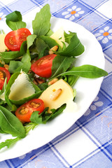 Ruccola salad with tomatoes, parmesan and pine nuts