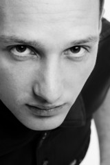 closeup of handsome young man staring