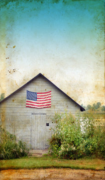 American flag on a rural shed with a grunge background.