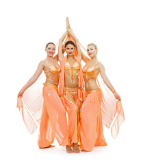young trio dancing arabian dance. isolated on white