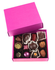 Chocolate candy group in pink box on white