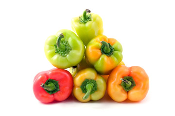 multi-coloured peppers isolated on white