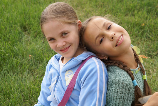 Two preteen girls having fun outdoors