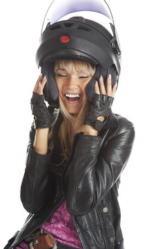 The beautiful girl with a motorcycle helmet