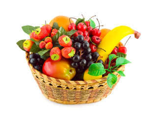 Basket with fruits (artificial) isolated on white background