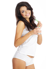 Young happy woman drinking milk
