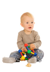 little boy play with toys. isolated on a white background