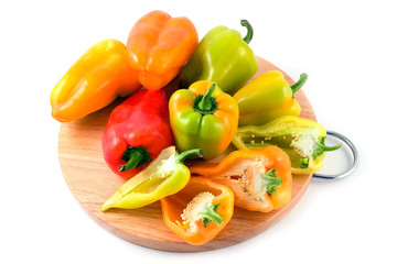 multi-coloured peppers isolated on white
