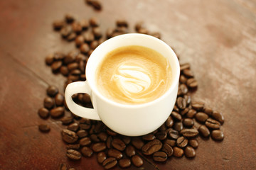 Cup of coffee and coffee beans