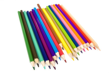 Coloured drawing pencils isolated on a white studio background.