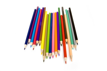 Coloured drawing pencils isolated on a white studio background.