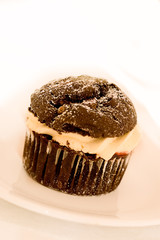 Chocolate muffin filled with cream.