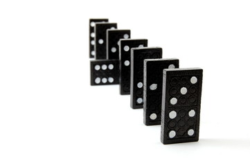 row of dominoes including a special domino stone isolated