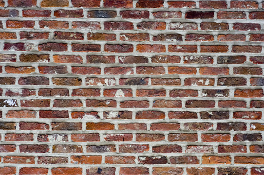 Fototapeta Roough red bricks and motar with the mortar outlinging the brick