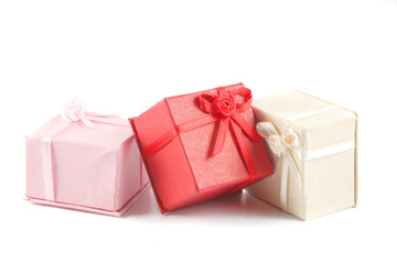 scattered, colorful small gift boxes for giving