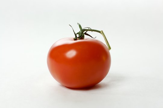 A fresh, healthy red tomato isolated on white background