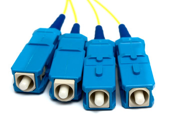 Four optical plugs  sc on a white background it is isolated