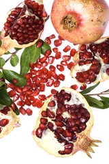 Ripe pomegranate fruit isolated on white bakcgorund