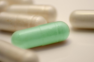 green pill is between whites