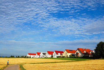 Tranquil landscape - hay fields and house range, Germany
