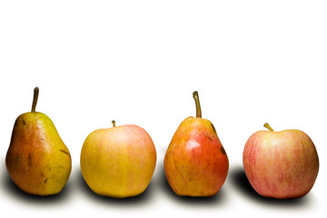 Apples and pears on a white surface