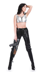 The armed girl in clothes from latex