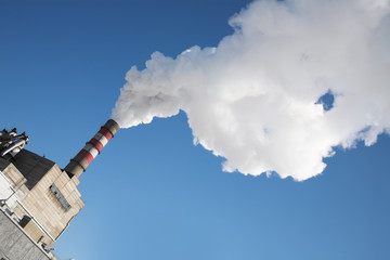 Smoke billowing from tall stacks