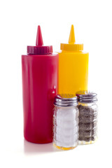 A cafe or restaurant tabletop setup with ketchup and mustard