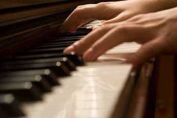 Pianists' hand playing the piano