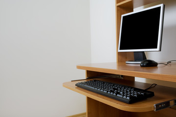 Fototapeta na wymiar Modern new computer on a wooden table