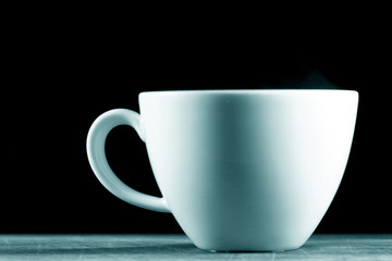 white cup of hot black coffee