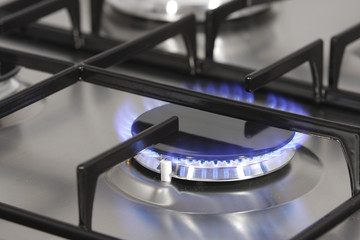 The flame on a gas burner in the hob