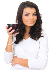 Beautiful business woman holding glass with red wine