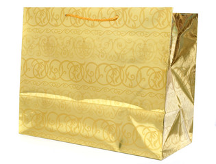 golden gift bag isolated against white background