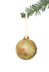 beautiful ornament hanging on a pine tree branch