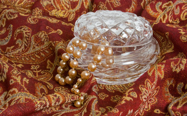 String of pearls and crystal bowl