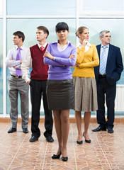 Confident business lady standing in front of group of people