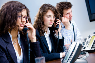 Young customer service operator team working at office,