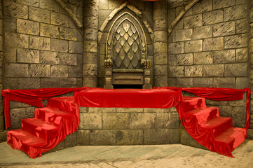 Empty middle-age royal throne with red velvet